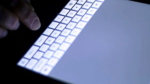 Woman Searching The Internet On Tablet Computer, Fingers Detail On Keyboard Video stock 70166816