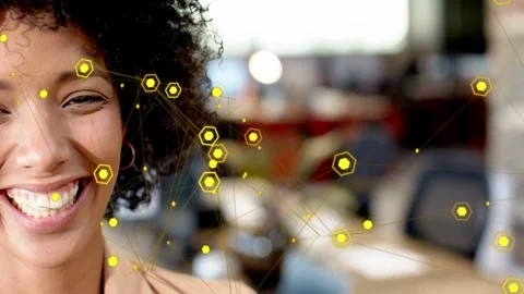 Woman seeing yellow hex node overlay appearing across face, smiling then 스톡 동영상 333105656