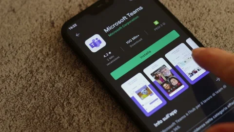 A  woman seeks Microsoft Teams application in Google play store on smartphone Stock-Footage 147350078