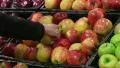 Woman Selecting Apples In Produce HD Footage