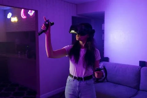 Woman selecting object in virtual space with gesture Stock Photos