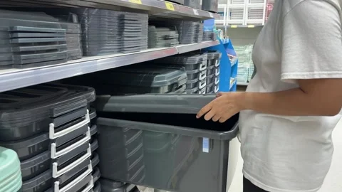 Woman selecting plastic box Stock Footage 345294295