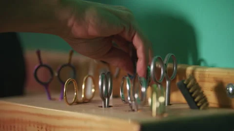 Woman selects scissors for cutting Stock Footage 274624283