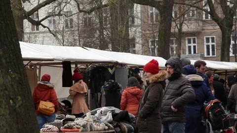 Woman sells clothes at flea market, Berlin, Germany Stock Footage