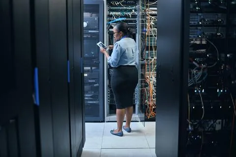 Woman, server room and engineer with a tablet for programming, system upgrade or Stock Photos