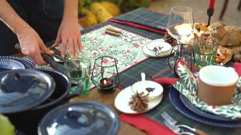 Woman serves the table puts forks knives plates. Stock Footage 145129422