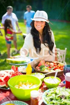 Woman Serving Food Outdoors