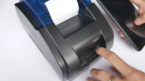 Woman Set up a Thermal Printer Connected to a Smartphone Stock Footage 133457741