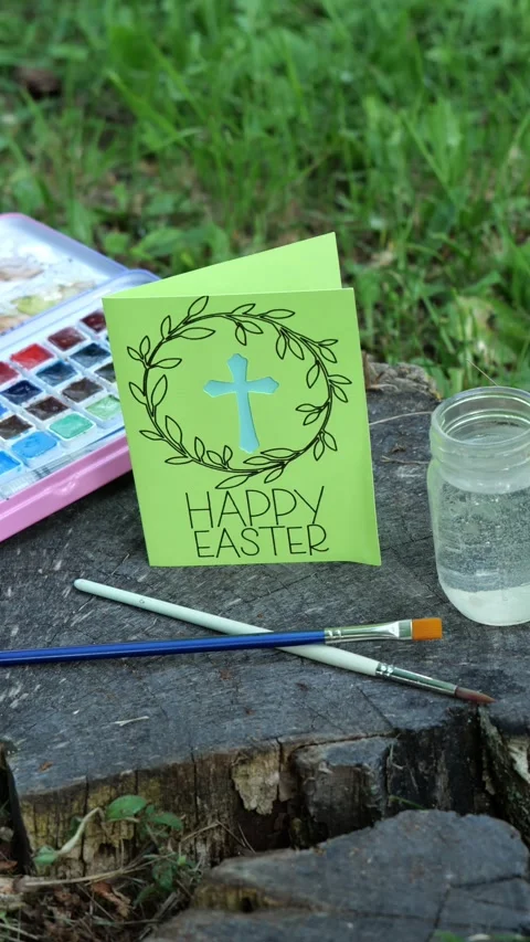 Woman Sets Down Handmade Happy Easter Card with Religious Christian Cross Video stock 320222778