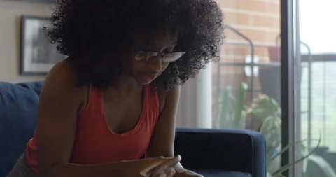 Woman Sets up New Amazon Echo Stock Footage 111159080