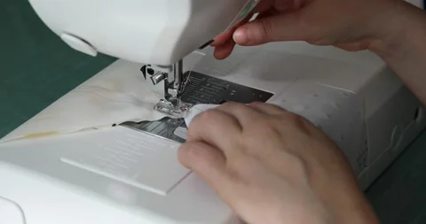 Woman sewing handmade patchwork blanket on machine Stock Footage 201442804