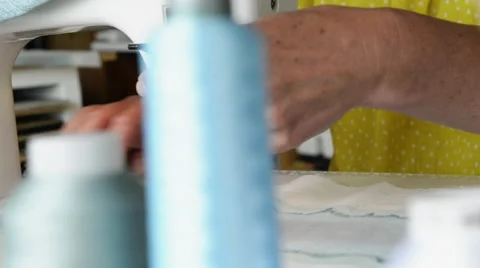 Woman sewing on machine Stock Footage