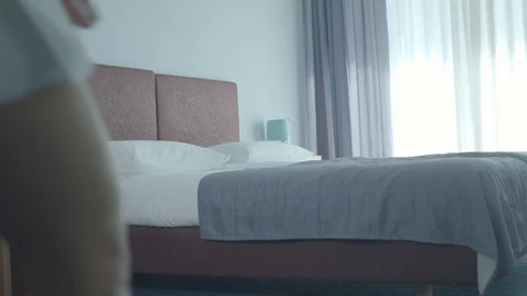 Woman In Shape In Towels Falling, Bouncing On A Bed In Hotel Room Stock Footage 95148864