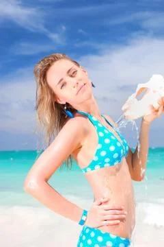 Woman with shell Stock Photos
