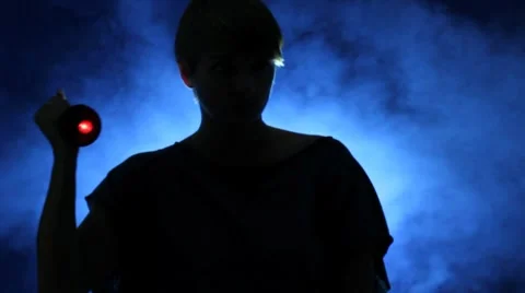 Woman shining a flashlight Stock Footage 8607475