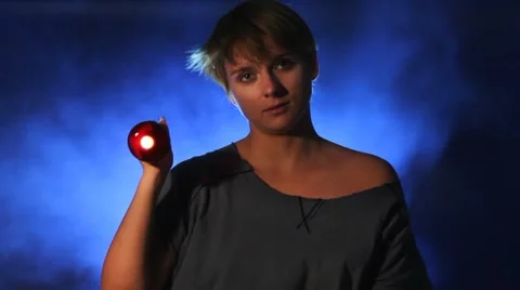 Woman shining a flashlight Stock Footage 8607493