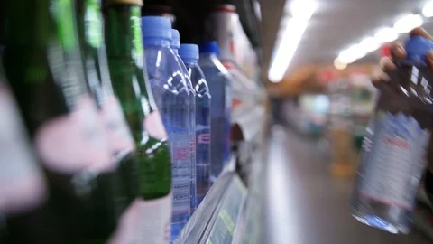 https://images.pond5.com/woman-shopper-taking-bottle-water-footage-098570304_iconl.jpeg