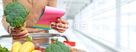 Woman with shopping cart. Stock Photos