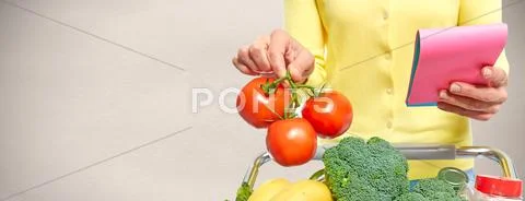 Woman with shopping cart. Stock Photos