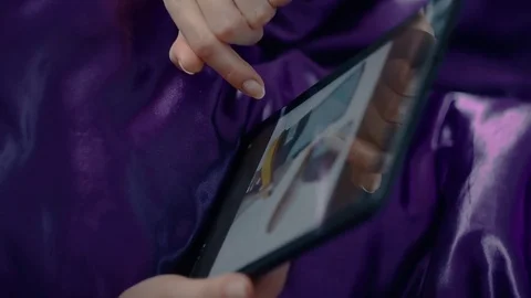 Woman Shopping Online Using A Tablet PC Stock Footage