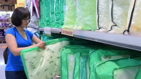 Woman shopping in sthe store of home textiles Stock Footage
