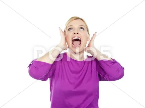 Woman shouting with hands on ears Stock Photos