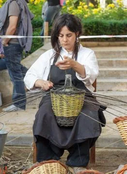 A woman showing the craft of basket-making Stock Photos