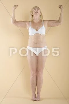 Woman showing her biceps Stock Photos