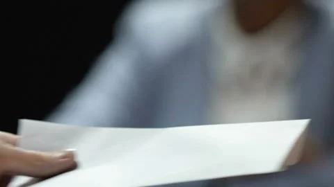 Woman showing stop gesture while man offering white envelope, bribe reject Stock Footage 88515345