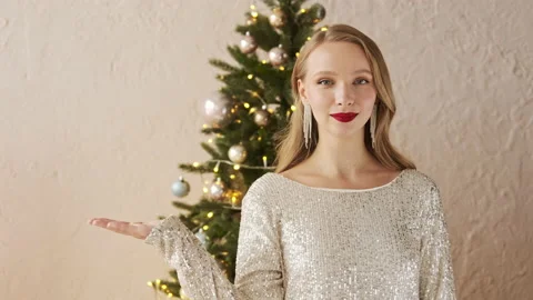 Woman shows copy space for your advertisement empty place Stock Footage 166322938