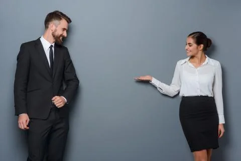 Woman shows something abstract Stock Photos