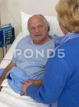 Woman With Sick Man In Hospital Room