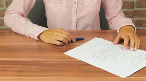 Woman Signing documents Stock Footage 11481981