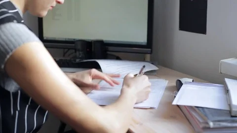 Woman signing documents Stock Footage 73085105