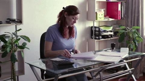 Woman signs documents at the table Video stock 59618892