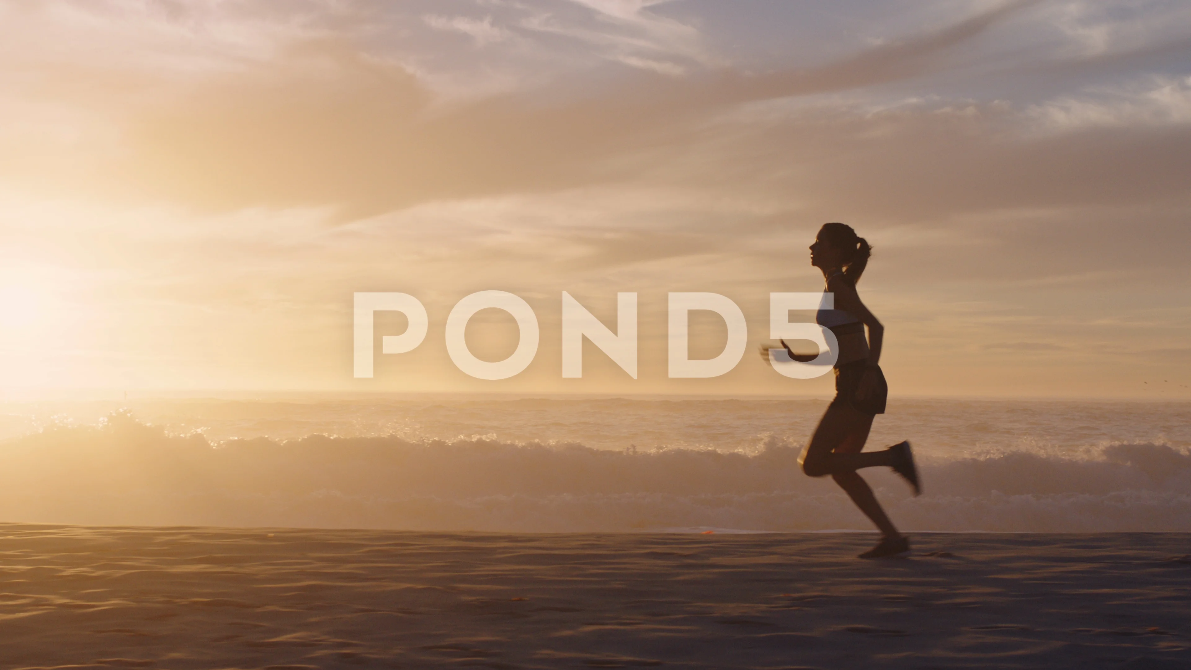 woman silhouette running on beach waves , Stock Video