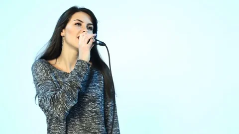 Woman singing in microphone and dancing Stock Footage 83088366