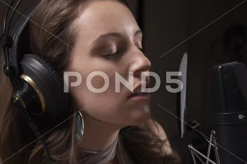 Woman Singing In Recording Studio