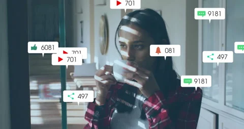 Woman sipping near window, causing floating social media icons rising then Stock Footage 313241664