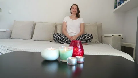 Woman sit on sofa meditation breathing techniques, mindfulness, yoga Stock Footage