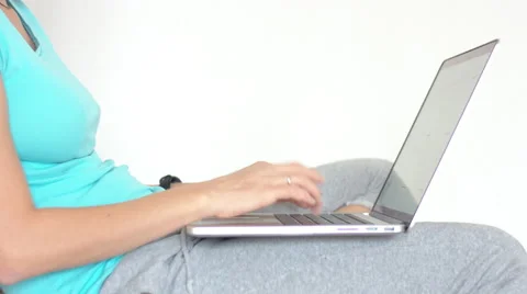 Woman siting on sofa and working on laptop 動画素材 68382004