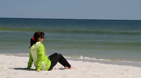 Woman Sitting Beach Video stock 24790911