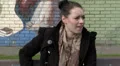 Woman sitting on bench chatting on phone HD Footage