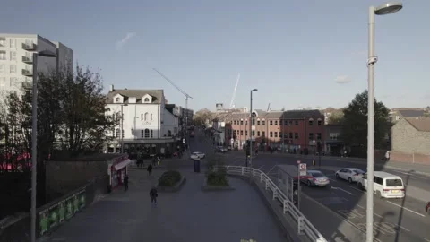 Woman sitting on bench on square, development in large city Stock-Footage 167953067