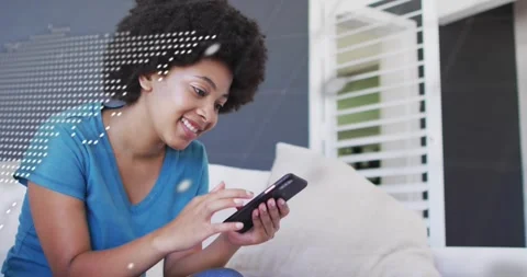 Woman sitting on couch, dotted map overlay and code shifting, revealing tapping Stock Footage 320724973