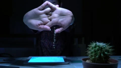 A woman is sitting at a desk and using a tablet Video stock 318914738