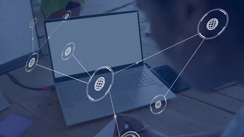 Woman sitting at desk taking notes, globe appearing on laptop, nodes connecting, Stock Footage 334729313