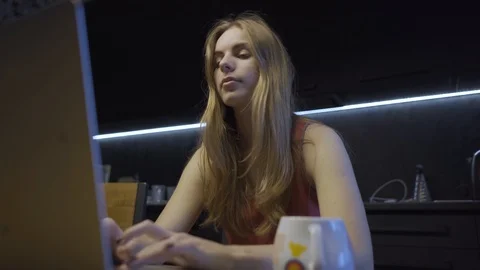 Woman sitting at the laptop while dancing Stock Footage 101664832