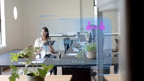 Woman sitting at long table, tapping tablet after HUD appearing on glass, Stock Footage 333318042