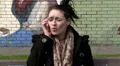 Woman sitting outside, upset on her mobile HD Footage